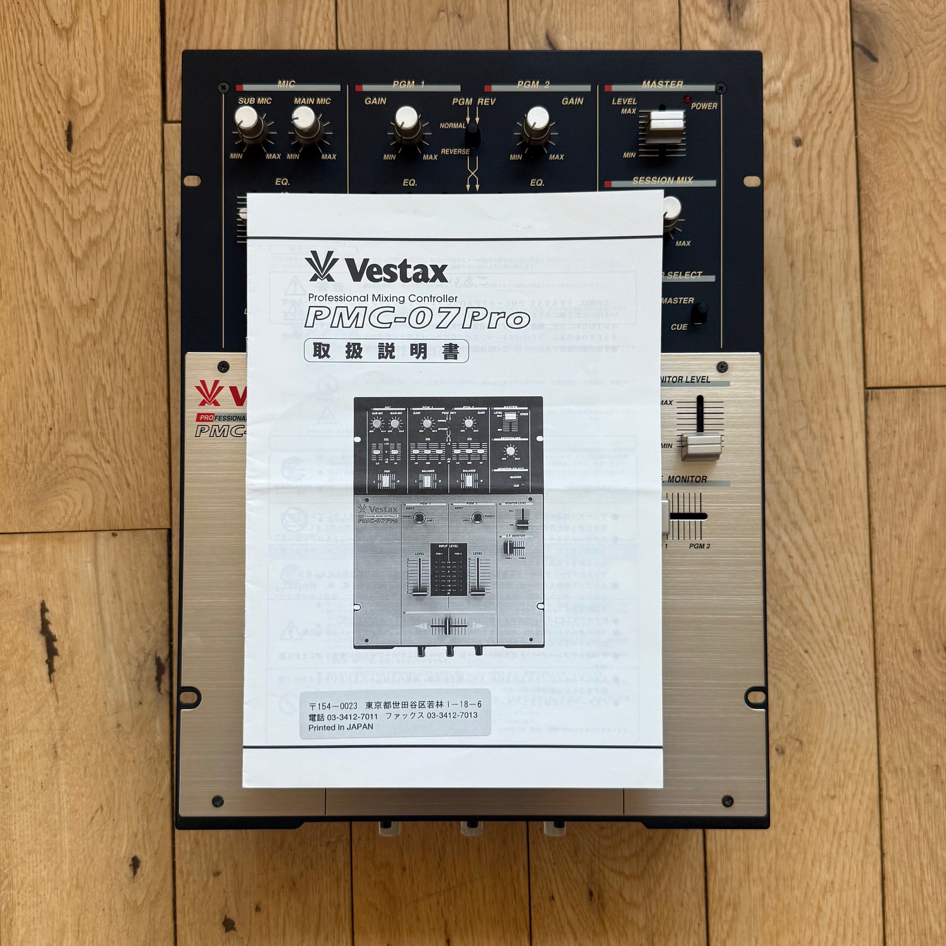 Top view of a serviced Vestax PMC-07 Pro with original Japanese instruction manual.