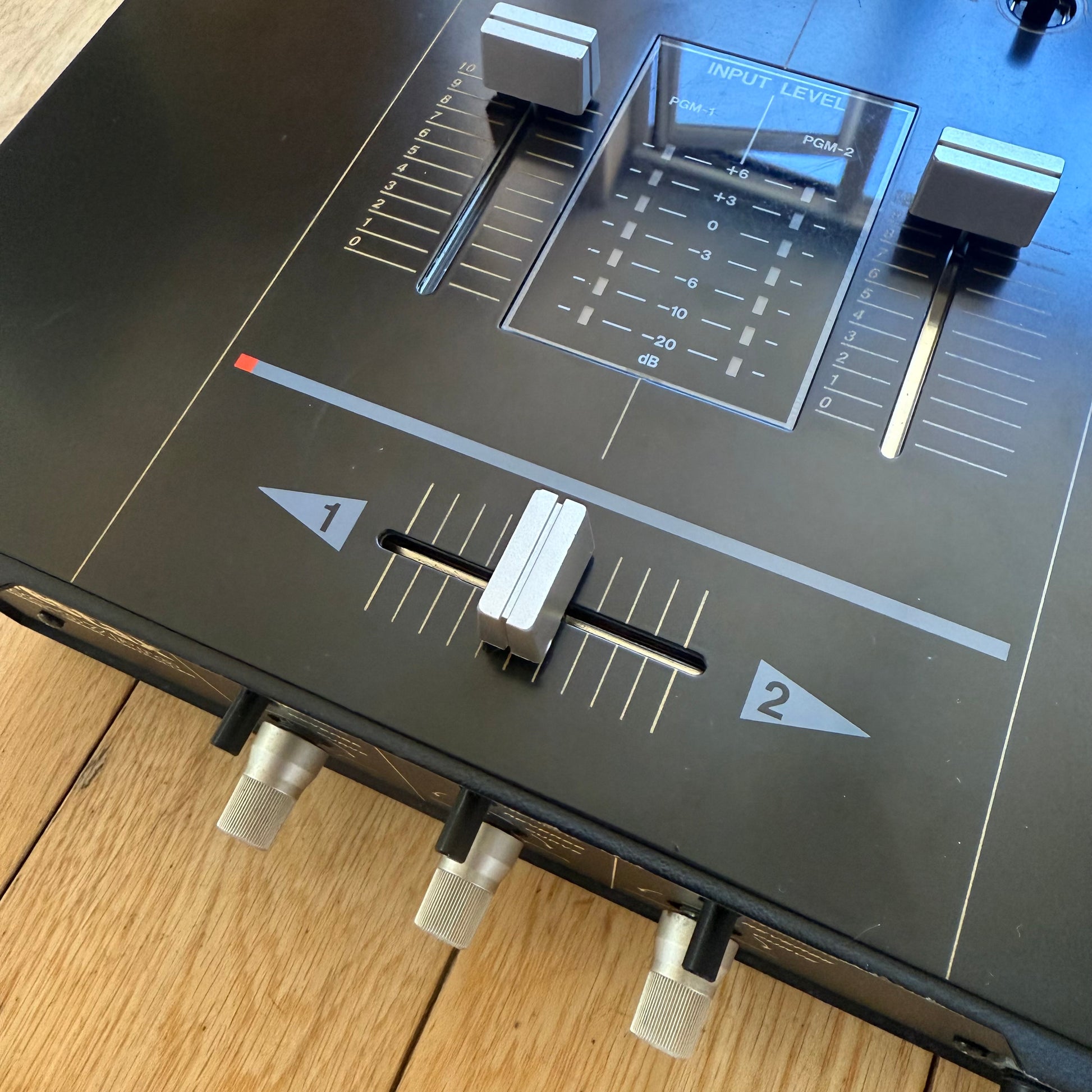 Close up view of the crossfader area of a Vestax PMC-07 Pro.