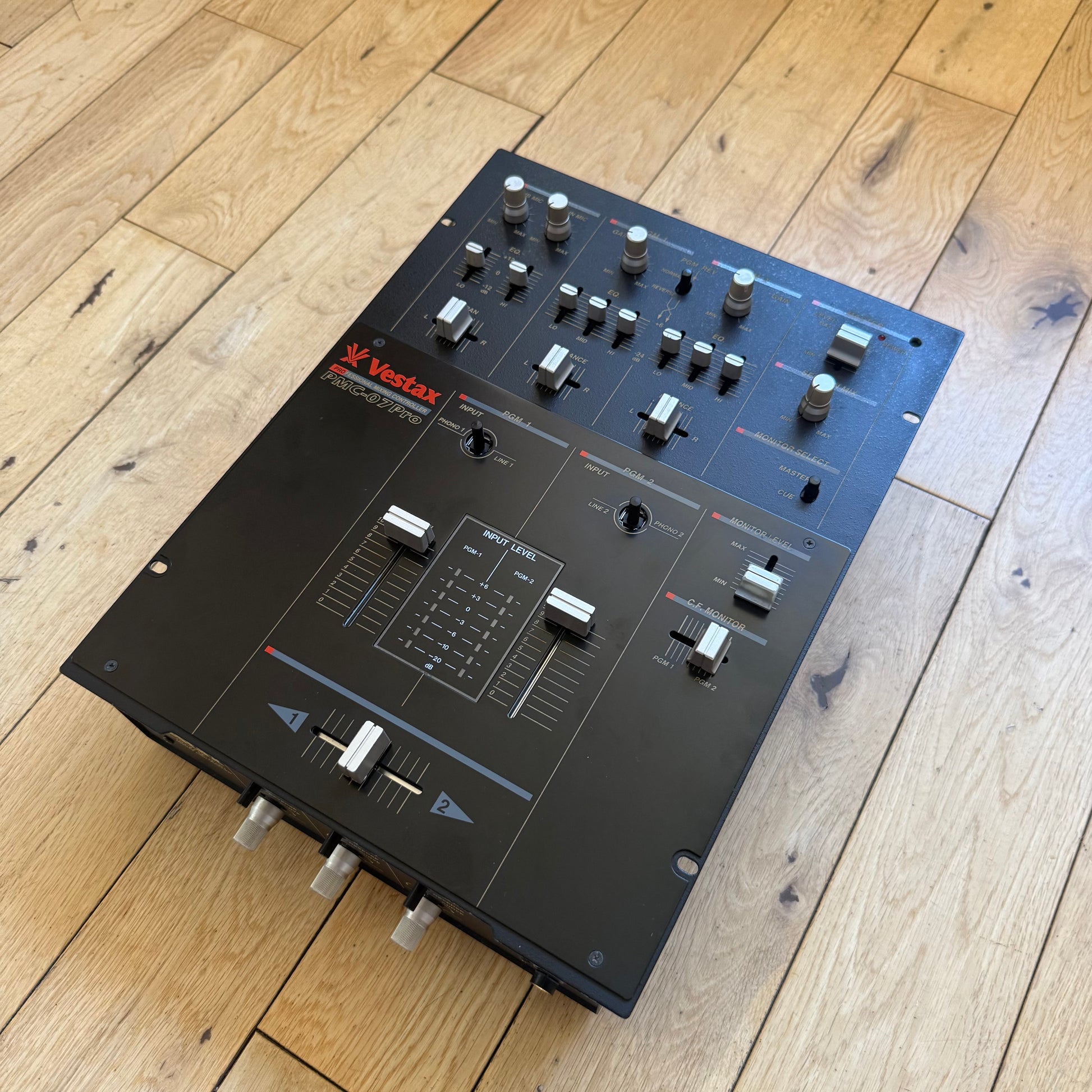 Isometric view of a Vestax PMC-07 Pro black edition mixer.